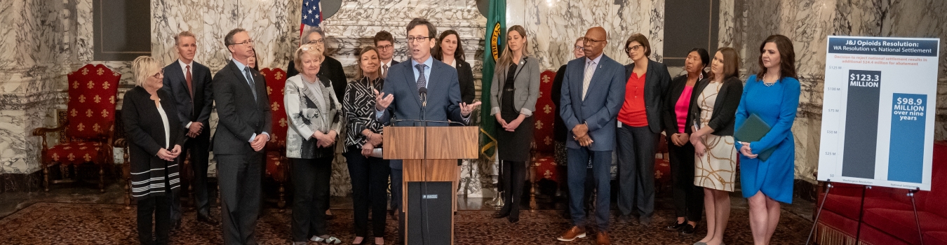 AG Ferguson speaks at a podium